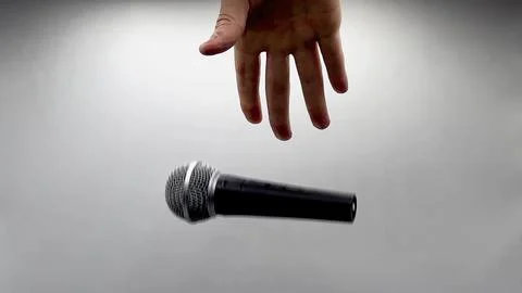 Drop the Mic on Sequence - Male Hand Black Mic Stockfoto's