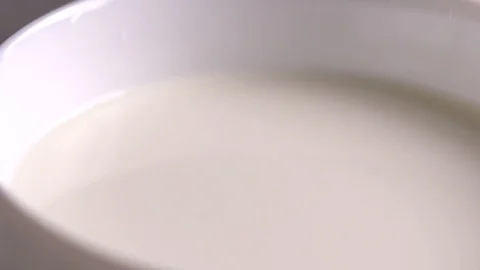 Drop of milk slow motion Stock Footage 123648294
