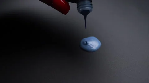 A drop of nail polish get down. Blue color Stock Footage 207131571