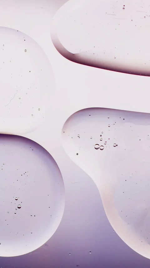 A drop of oil on a white background absorbs another drop Vídeo Stock 237706684