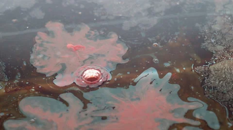 Drop of orange oil paint falling in water Stock Footage 46667138