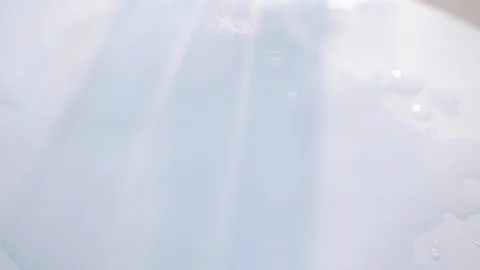 A drop of paint drips onto the paper 4K Video stock 117535774
