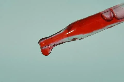 The drop in the pipette of blood. The concept of developing a pharmaceutical Stock Photos