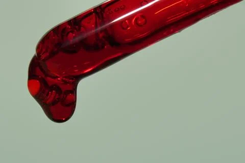 The drop in the pipette of blood. The concept of developing a pharmaceutical Stock Photos