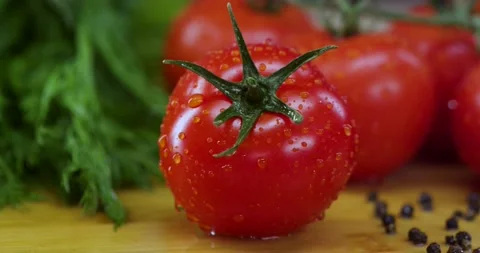 Drop runs down the tomato Stock Footage 130775737