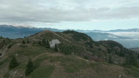 Drop shot of a hilly area covered with sparse trees Stock Footage 268247871