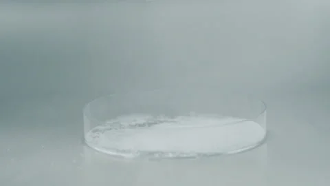 Drop sugar to the glass container high angle close up slow motion Video stock 159129606