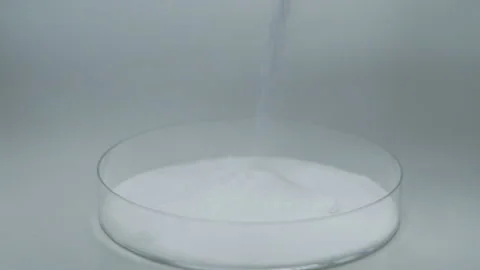 Drop sugar to the glass container high angle close up Stock Footage 159140925
