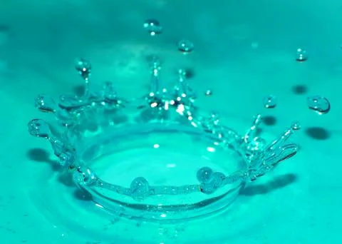 Drop on the surface of a liquid Stock Photos