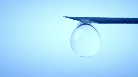 Drop on syringe needle. Medicine concept Stock Footage 88927760