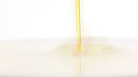 Drop of syrup falls into milk. Slow motion, super closeup Stock Footage 76150009