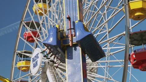 Drop Tower lists riders up and down on Santa Monica Pier midway Stock Footage 134064798