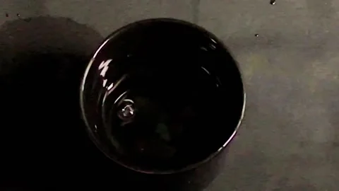 Drop water in black cup Stock-Footage 221419405