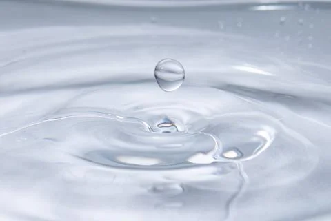 Drop of water. Colored drops background. Fotos Stock