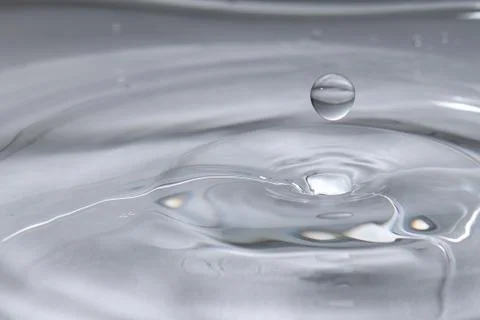 Drop of water. Colored drops background. Fotos Stock