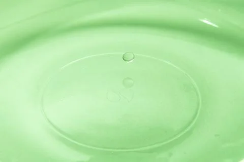 Drop of water. Colored drops background. Fotos Stock