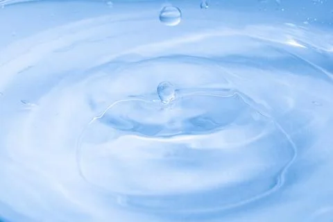 Drop of water. Colored drops background. Fotos Stock
