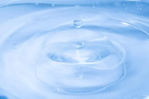 Drop of water. Colored drops background. Fotos Stock