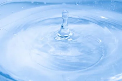 Drop of water. Colored drops background. Stock Photos