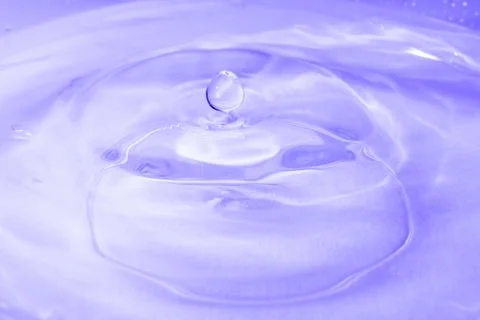 Drop of water. Colored drops background. Stock Photos