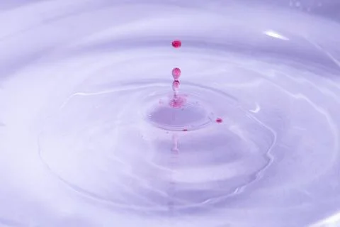 Drop of water. Colored drops background. Fotos Stock