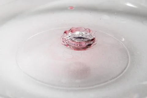 Drop of water. Colored drops background. Fotos Stock