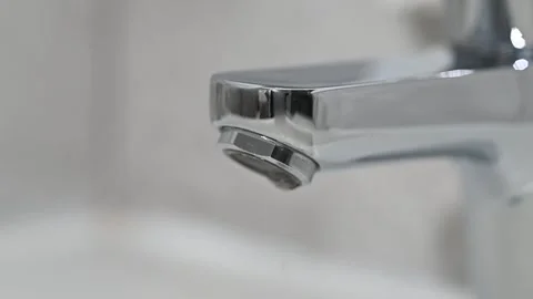Drop of water drips from the tap. Beautiful fresh and clean water flowing from a Stock Footage 287336853