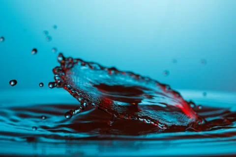 Drop of water falling down in the water Stock-Fotos