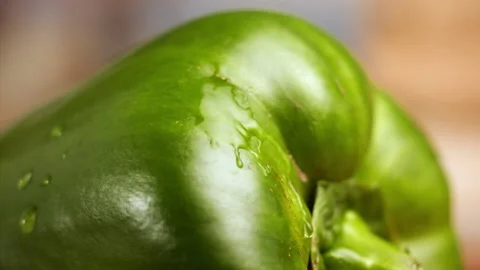 Drop of water falling on green bell pepper in slow motion Stock Footage 152902661