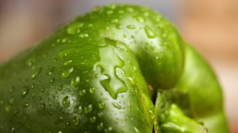 Drop of water falling on green bell pepper in slow motion Stock Footage 152902905