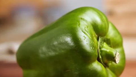 Drop of water falling on green bell pepper in slow motion Stock Footage 152903849