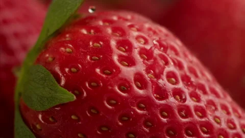 Drop of water falling on strawberry in slow motion Stock Footage 156202032