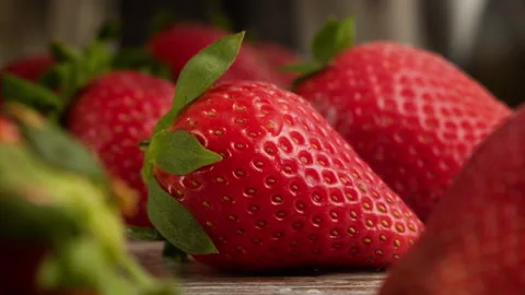 Drop of water falling on strawberry in slow motion Stock Footage 156202128