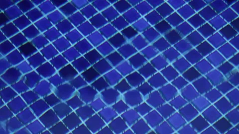 A drop of water falling in a swiming pool Stock Footage 75277820