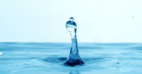 Drop of water falls into a drop of water in a super slow motion. Shot on su.. Stock Footage 329845733