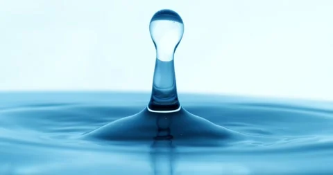 Drop of water falls into a drop of water in a super slow motion. Shot on su.. Stock Footage 333110266