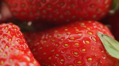 A drop of water falls on fresh, ripe, juicy, delicious strawberries. Macro shot. Stock Footage 50307639