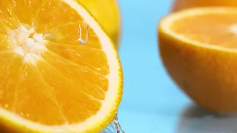A drop of water falls on a  orange blue background Super slow-mo 1000 fps Stock Footage 276732041