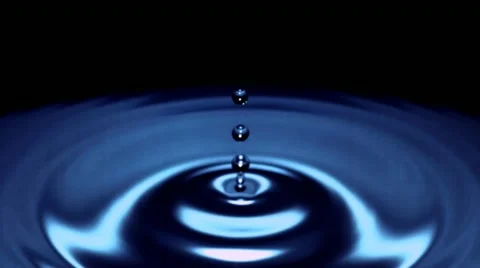 Drop of water falls in slow motion - blue surface - 02 - High Speed 1050fps Stock Footage 11611864