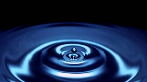 Drop of water falls in slow motion - blue surface - 05 - High Speed 1050fps Stock Footage 11611877
