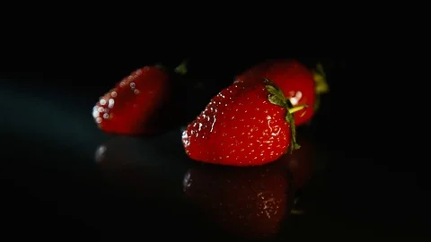 A drop of water falls on the strawberry Stock Footage 89764431