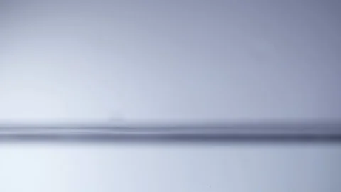 A drop of water falls on the water surface Stock-Footage 104904395