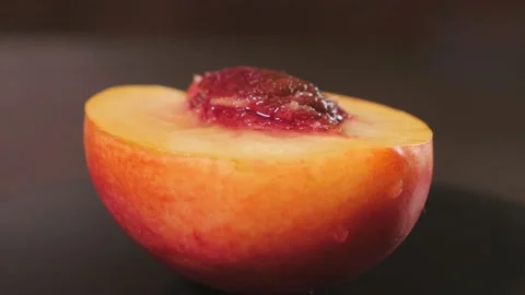 Drop of water flows down the surface of a ripe juicy peach Stock Footage 167213716