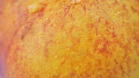 Drop of water flows down the surface of a ripe juicy peach Stock Footage 214079714