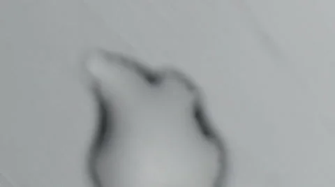 A drop of water forms a crystal Stock Footage 60389970