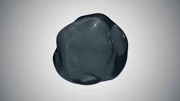 A drop of water hangs in the air in zero gravity. the sphere from the liquid Stock Footage 85866008