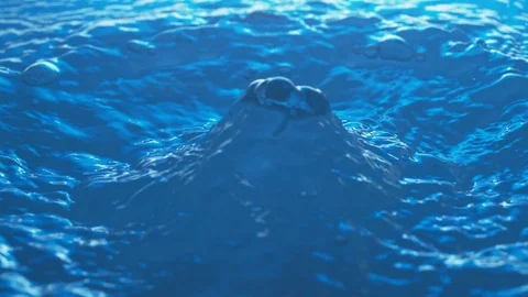 Drop of Water hits Water Surface in Slow Motion then it's blown away. Video stock 84184828