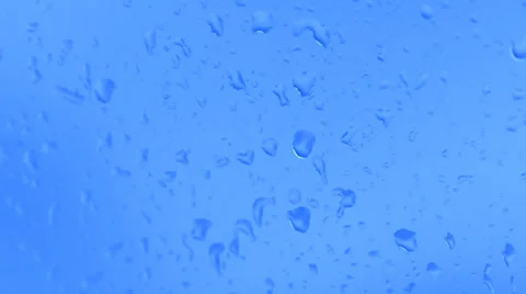 Drop of water runs down the glass surface with condensate Stock Footage 30459926