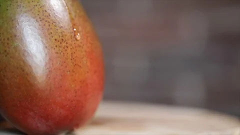 Drop of Water Slowly runs down a Mango Closeup No. 2 動画素材 99163792