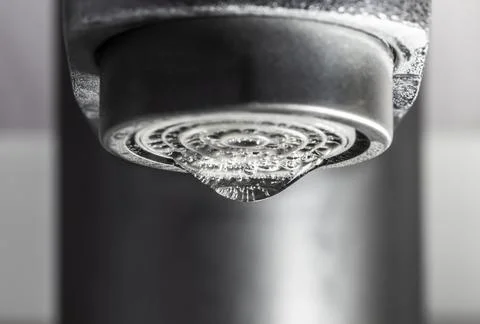 A drop of water on the tap Stock Photos
